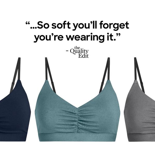 A clean, studio-lit 1:1 image presenting three color variations of a soft comfort bra with a clear, benefit-focused testimonial quote.